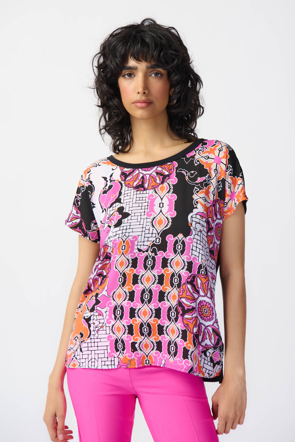 Defined by its vibrant medallion print, this short-sleeved top exudes unmistakable femininity. Crafted from lightweight georgette fabric and complemented by silky knit accents, this top features a scoop neckline and a relaxed, boxy fit.