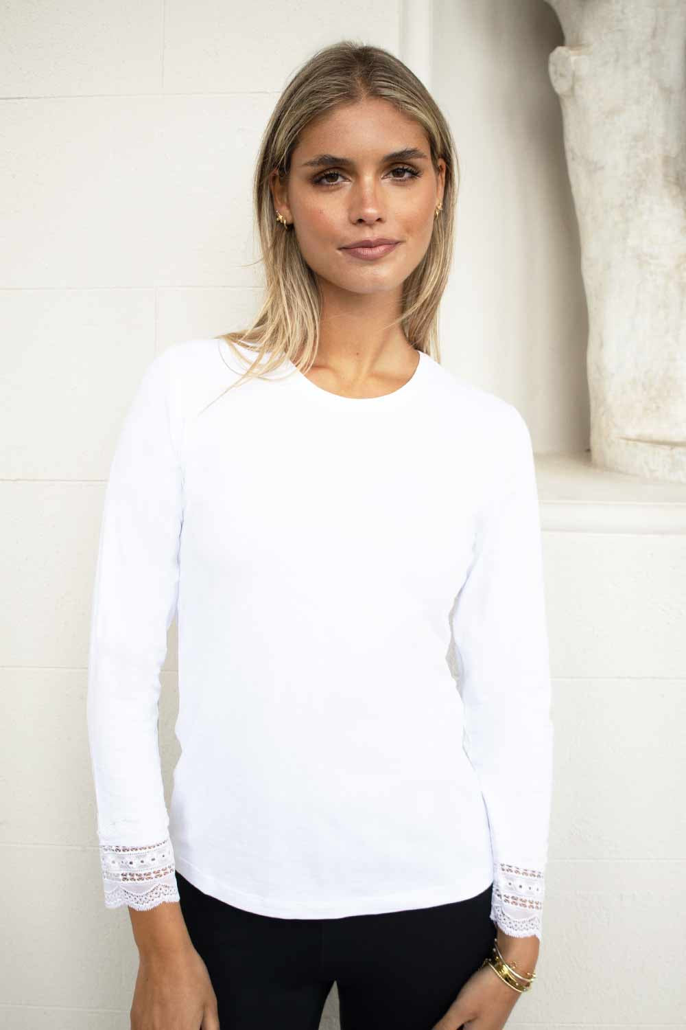 As a fashion connoisseur, you understand the power of a well-curated wardrobe. And now, you have the opportunity to upgrade your fashion game with the exquisite Evelin Brandt's No 2 Moro white cotton top with lace trim. Prepare to embark on a journey of unparalleled style and versatilit