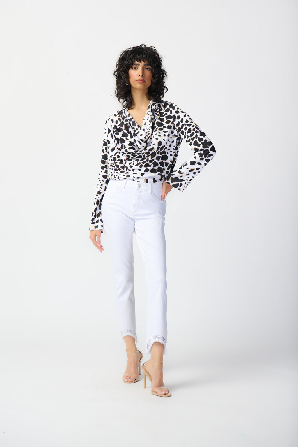 This elegant satin top is crafted from a smooth satin adorned with a subtle animal print. Its straight silhouette is universally flattering, while a cowl neckline with a shirt collar adds a bold touch to this memorable statement piece.