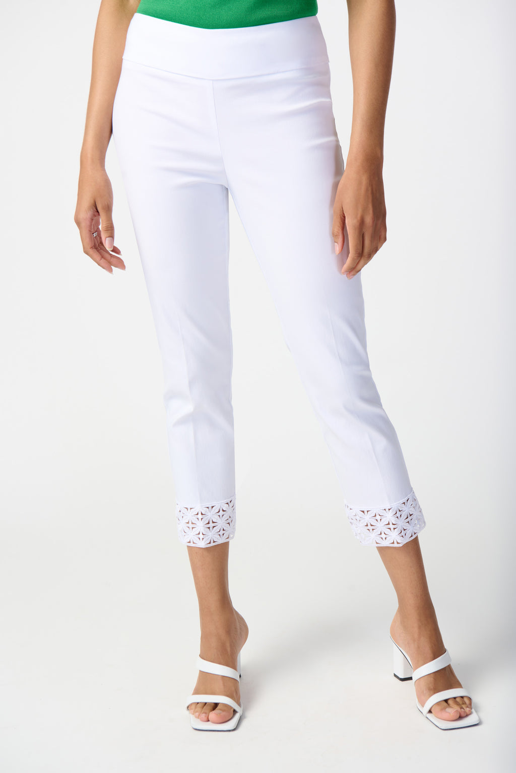 Take your look from day to night with these chic pull-on pants. Tailored with a cropped silhouette in a beautiful millennium fabric, this contemporary piece features a structured contour waistband, pairing style and comfort to perfection. A small Joseph Ribkoff ornament at the back of the pants and a lovely guipure detail at the hem put the finishing touch and add a hint more of elegance to this wardrobe staple.