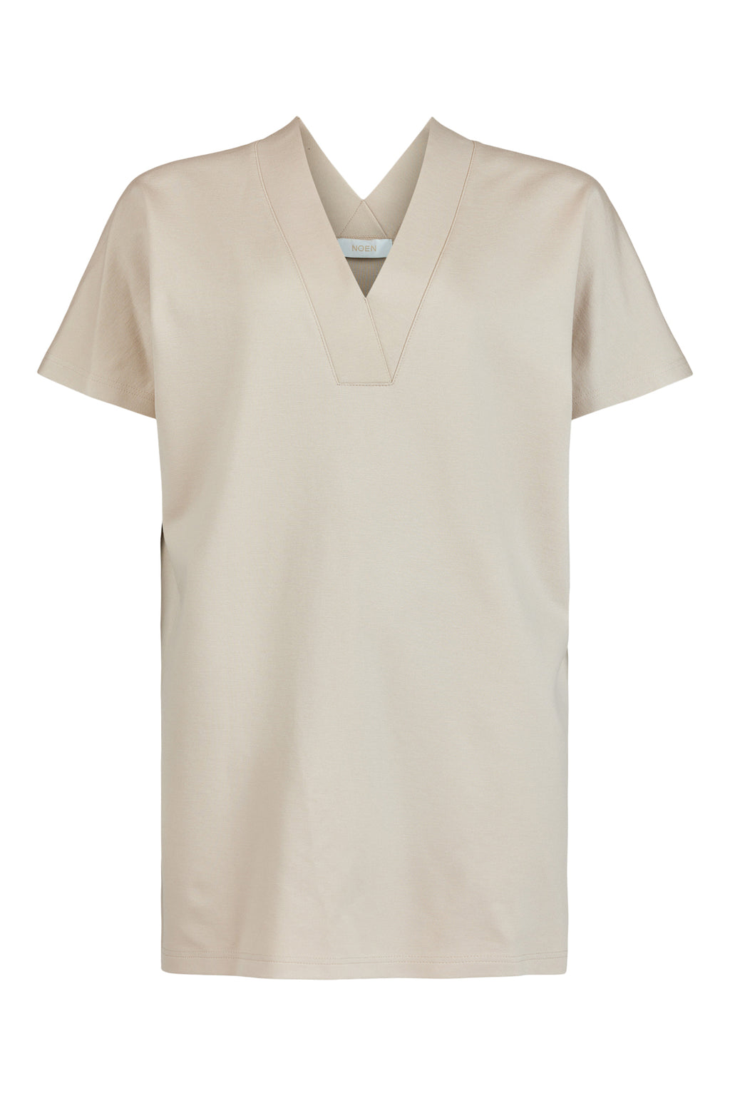 Enhance your wardrobe with our Tunic in Sand, a perfect blend of fashion and functionality. Crafted from high-quality jersey fabric, this tunic offers utmost comfort and a soft touch against your skin.  Featuring a chic v-neck design in both the front and back, this tunic adds a touch of elegance to any ensemble. Its long-line silhouette and side splits not only provide a flattering fit but also allow for easy movement and breath ability.
