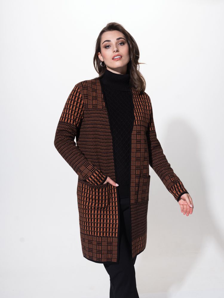 Elevate your cozy style with this long line cardigan!  It features two convenient patch pockets on the front, perfect for storing your essentials or keeping your hands warm. The soft touch fabric adds a luxurious feel to this Black and Tan cardigan. With its edge-to-edge design, it effortlessly drapes over your outfit for a chic and effortless look. Stay comfortable and fashionable with this must-have cardigan.